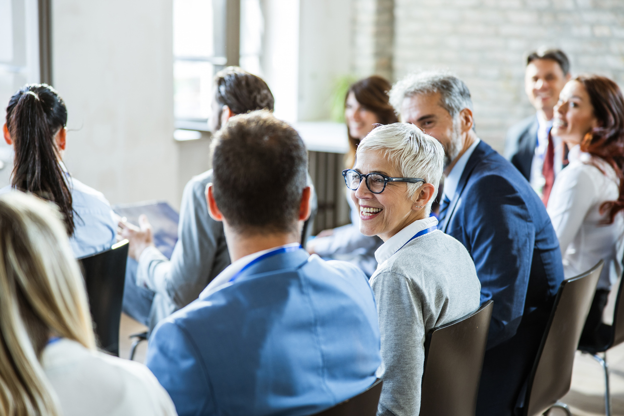 Business meeting with diverse participants discussing ideas.