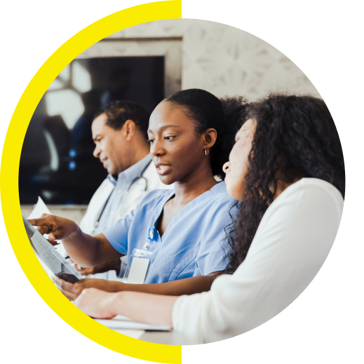Healthcare professionals reviewing documents together.