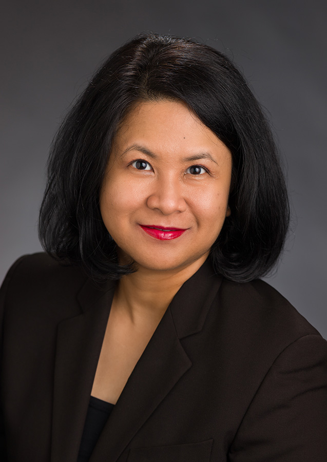 Professional portrait of a woman in a blazer.