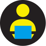 Icon of person using a laptop computer.